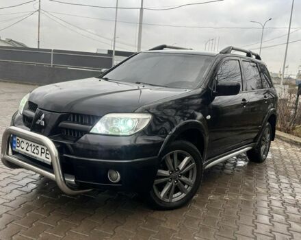 Черный Мицубиси Аутлендер, объемом двигателя 2.4 л и пробегом 244 тыс. км за 6800 $, фото 1 на Automoto.ua