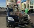 Черный Мицубиси Аутлендер, объемом двигателя 2.4 л и пробегом 135 тыс. км за 6500 $, фото 1 на Automoto.ua