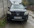 Черный Мицубиси Аутлендер, объемом двигателя 2.4 л и пробегом 490 тыс. км за 6500 $, фото 1 на Automoto.ua