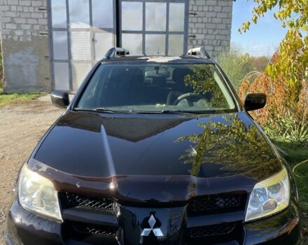 Черный Мицубиси Аутлендер, объемом двигателя 2 л и пробегом 156 тыс. км за 4200 $, фото 2 на Automoto.ua