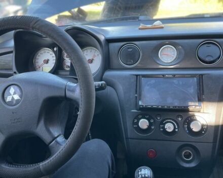 Черный Мицубиси Аутлендер, объемом двигателя 2 л и пробегом 156 тыс. км за 4200 $, фото 10 на Automoto.ua