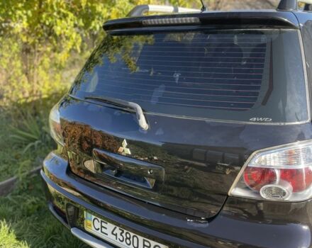 Черный Мицубиси Аутлендер, объемом двигателя 2 л и пробегом 156 тыс. км за 4200 $, фото 5 на Automoto.ua