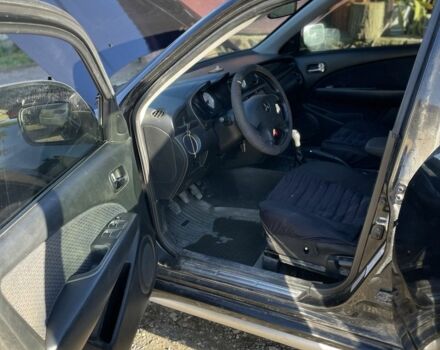 Черный Мицубиси Аутлендер, объемом двигателя 2 л и пробегом 156 тыс. км за 4200 $, фото 12 на Automoto.ua