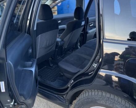 Черный Мицубиси Аутлендер, объемом двигателя 2.4 л и пробегом 220 тыс. км за 9500 $, фото 7 на Automoto.ua