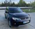 Черный Мицубиси Аутлендер, объемом двигателя 2.4 л и пробегом 220 тыс. км за 9500 $, фото 1 на Automoto.ua