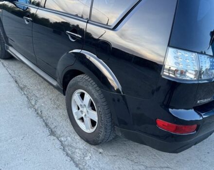 Черный Мицубиси Аутлендер, объемом двигателя 2.4 л и пробегом 220 тыс. км за 9500 $, фото 2 на Automoto.ua