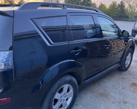 Черный Мицубиси Аутлендер, объемом двигателя 2.4 л и пробегом 220 тыс. км за 9500 $, фото 1 на Automoto.ua