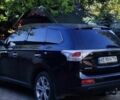 Черный Мицубиси Аутлендер, объемом двигателя 2.4 л и пробегом 220 тыс. км за 13400 $, фото 2 на Automoto.ua