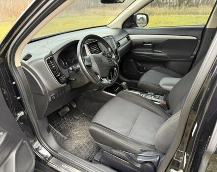 Черный Мицубиси Аутлендер, объемом двигателя 2.4 л и пробегом 130 тыс. км за 14950 $, фото 1 на Automoto.ua