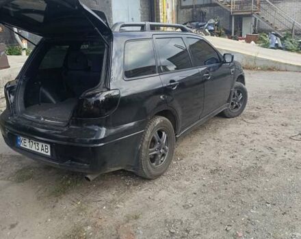 Черный Мицубиси Аутлендер, объемом двигателя 2.38 л и пробегом 212 тыс. км за 4800 $, фото 5 на Automoto.ua