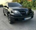 Черный Мицубиси Аутлендер, объемом двигателя 2.38 л и пробегом 212 тыс. км за 4800 $, фото 1 на Automoto.ua