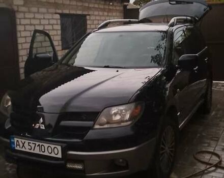 Чорний Міцубісі Аутлендер, об'ємом двигуна 2.38 л та пробігом 275 тис. км за 6000 $, фото 11 на Automoto.ua
