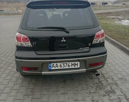 Черный Мицубиси Аутлендер, объемом двигателя 2 л и пробегом 250 тыс. км за 5750 $, фото 4 на Automoto.ua