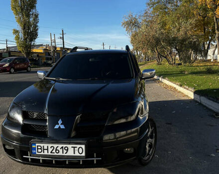 Черный Мицубиси Аутлендер, объемом двигателя 2.4 л и пробегом 267 тыс. км за 6900 $, фото 1 на Automoto.ua