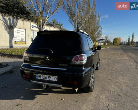Черный Мицубиси Аутлендер, объемом двигателя 2.4 л и пробегом 267 тыс. км за 6900 $, фото 10 на Automoto.ua