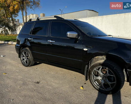 Черный Мицубиси Аутлендер, объемом двигателя 2.4 л и пробегом 267 тыс. км за 6900 $, фото 4 на Automoto.ua