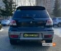 Черный Мицубиси Аутлендер, объемом двигателя 2 л и пробегом 293 тыс. км за 5999 $, фото 5 на Automoto.ua