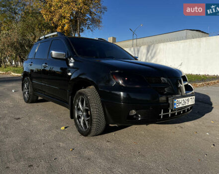 Черный Мицубиси Аутлендер, объемом двигателя 2.4 л и пробегом 267 тыс. км за 6900 $, фото 3 на Automoto.ua