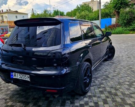 Чорний Міцубісі Аутлендер, об'ємом двигуна 2 л та пробігом 143 тис. км за 8500 $, фото 4 на Automoto.ua