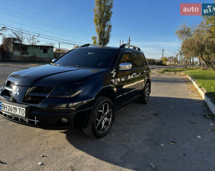 Черный Мицубиси Аутлендер, объемом двигателя 2.4 л и пробегом 267 тыс. км за 6900 $, фото 6 на Automoto.ua