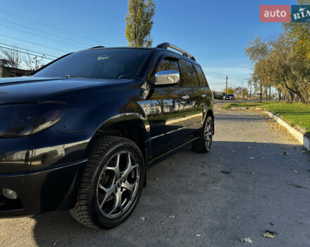 Черный Мицубиси Аутлендер, объемом двигателя 2.4 л и пробегом 267 тыс. км за 6900 $, фото 8 на Automoto.ua