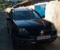 Чорний Міцубісі Аутлендер, об'ємом двигуна 2.38 л та пробігом 275 тис. км за 6000 $, фото 1 на Automoto.ua