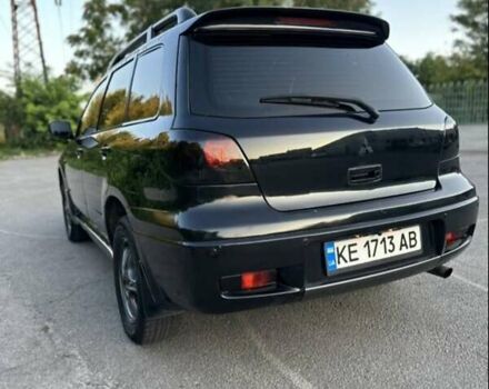 Черный Мицубиси Аутлендер, объемом двигателя 2.38 л и пробегом 212 тыс. км за 4800 $, фото 2 на Automoto.ua