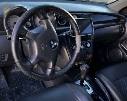 Черный Мицубиси Аутлендер, объемом двигателя 2.4 л и пробегом 267 тыс. км за 6900 $, фото 13 на Automoto.ua