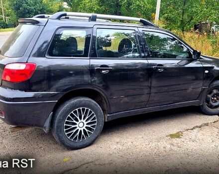 Черный Мицубиси Аутлендер, объемом двигателя 2 л и пробегом 194 тыс. км за 4200 $, фото 1 на Automoto.ua