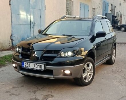 Черный Мицубиси Аутлендер, объемом двигателя 2.4 л и пробегом 243 тыс. км за 1846 $, фото 3 на Automoto.ua