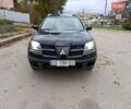 Черный Мицубиси Аутлендер, объемом двигателя 2.38 л и пробегом 293 тыс. км за 4999 $, фото 7 на Automoto.ua