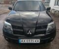Черный Мицубиси Аутлендер, объемом двигателя 2.4 л и пробегом 3 тыс. км за 5500 $, фото 1 на Automoto.ua