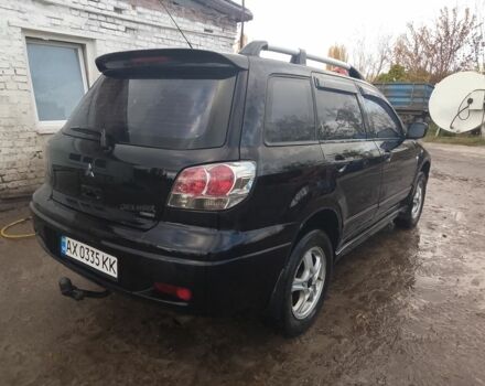 Черный Мицубиси Аутлендер, объемом двигателя 2.4 л и пробегом 3 тыс. км за 5500 $, фото 1 на Automoto.ua