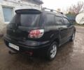 Черный Мицубиси Аутлендер, объемом двигателя 2.4 л и пробегом 3 тыс. км за 5500 $, фото 1 на Automoto.ua
