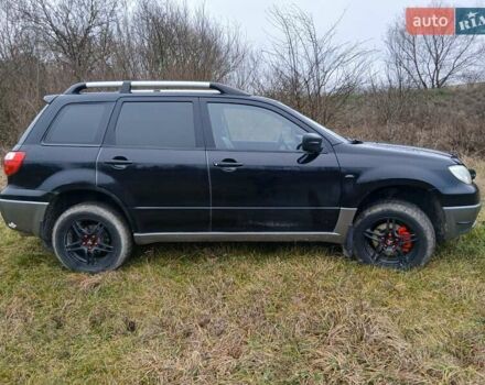 Черный Мицубиси Аутлендер, объемом двигателя 2 л и пробегом 395 тыс. км за 5200 $, фото 17 на Automoto.ua