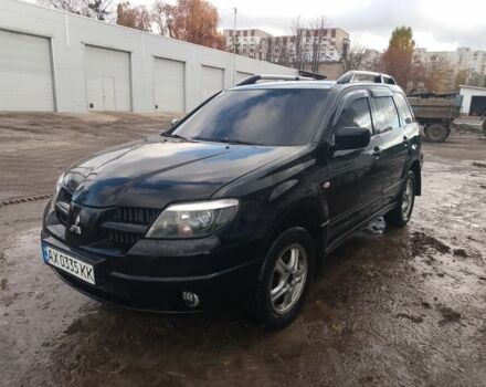 Черный Мицубиси Аутлендер, объемом двигателя 2.4 л и пробегом 3 тыс. км за 5500 $, фото 2 на Automoto.ua