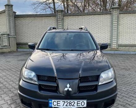 Чорний Міцубісі Аутлендер, об'ємом двигуна 2.38 л та пробігом 294 тис. км за 4550 $, фото 4 на Automoto.ua
