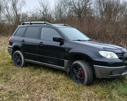 Черный Мицубиси Аутлендер, объемом двигателя 2 л и пробегом 395 тыс. км за 5200 $, фото 11 на Automoto.ua