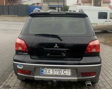 Черный Мицубиси Аутлендер, объемом двигателя 2 л и пробегом 300 тыс. км за 6500 $, фото 4 на Automoto.ua