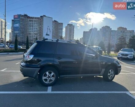 Черный Мицубиси Аутлендер, объемом двигателя 2.4 л и пробегом 351 тыс. км за 4999 $, фото 3 на Automoto.ua