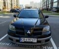 Черный Мицубиси Аутлендер, объемом двигателя 2.38 л и пробегом 243 тыс. км за 5450 $, фото 1 на Automoto.ua