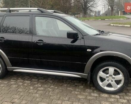 Черный Мицубиси Аутлендер, объемом двигателя 2 л и пробегом 300 тыс. км за 6500 $, фото 3 на Automoto.ua