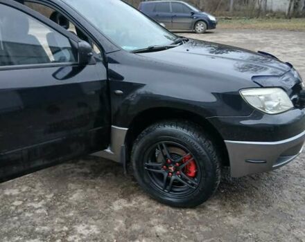 Черный Мицубиси Аутлендер, объемом двигателя 2 л и пробегом 395 тыс. км за 5200 $, фото 10 на Automoto.ua