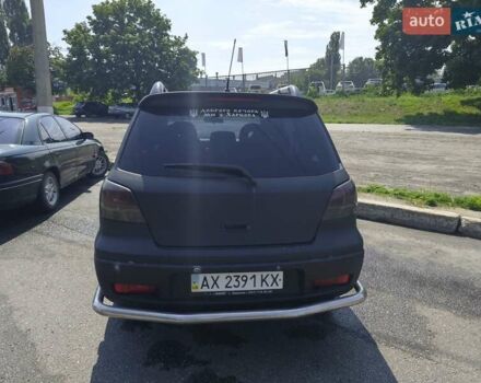 Черный Мицубиси Аутлендер, объемом двигателя 2 л и пробегом 174 тыс. км за 4400 $, фото 1 на Automoto.ua