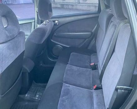 Чорний Міцубісі Аутлендер, об'ємом двигуна 2.38 л та пробігом 294 тис. км за 4550 $, фото 10 на Automoto.ua