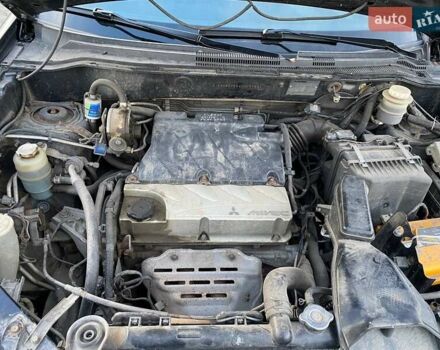 Чорний Міцубісі Аутлендер, об'ємом двигуна 2.38 л та пробігом 294 тис. км за 4550 $, фото 11 на Automoto.ua