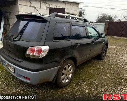 Черный Мицубиси Аутлендер, объемом двигателя 2.4 л и пробегом 357 тыс. км за 5190 $, фото 7 на Automoto.ua