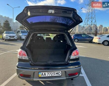 Черный Мицубиси Аутлендер, объемом двигателя 2.4 л и пробегом 351 тыс. км за 4999 $, фото 11 на Automoto.ua