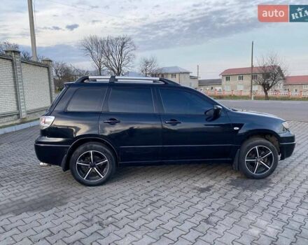 Чорний Міцубісі Аутлендер, об'ємом двигуна 2.38 л та пробігом 294 тис. км за 4550 $, фото 3 на Automoto.ua