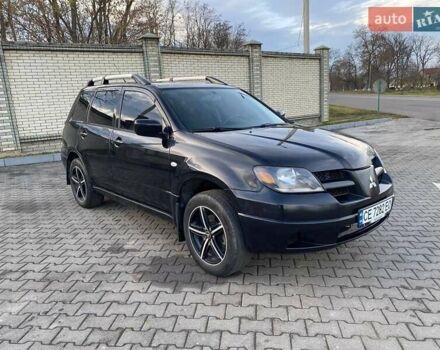 Чорний Міцубісі Аутлендер, об'ємом двигуна 2.38 л та пробігом 294 тис. км за 4550 $, фото 12 на Automoto.ua